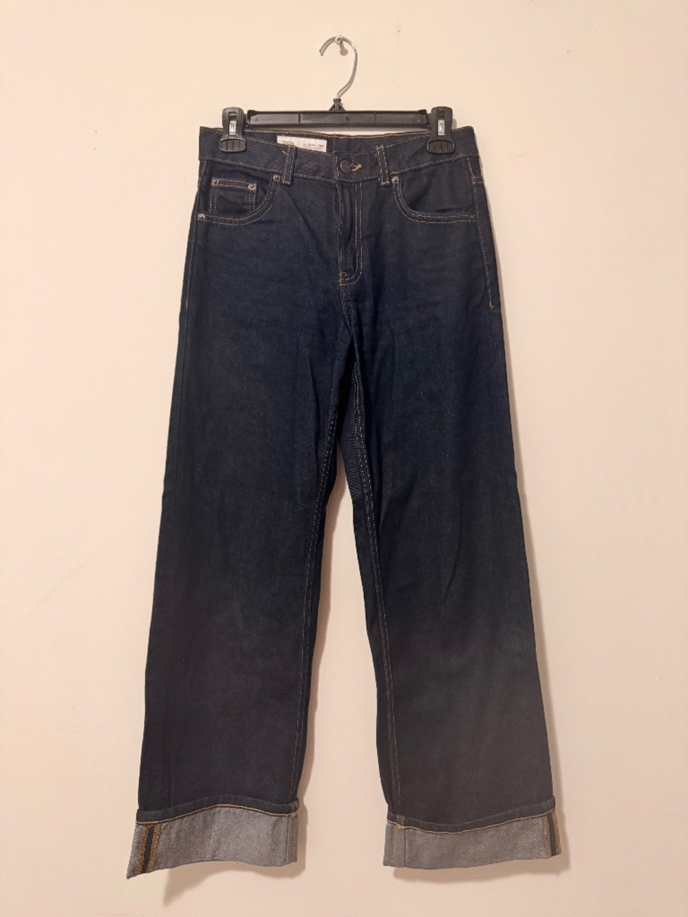 Wide legged jeans with rolled-up cuffs
